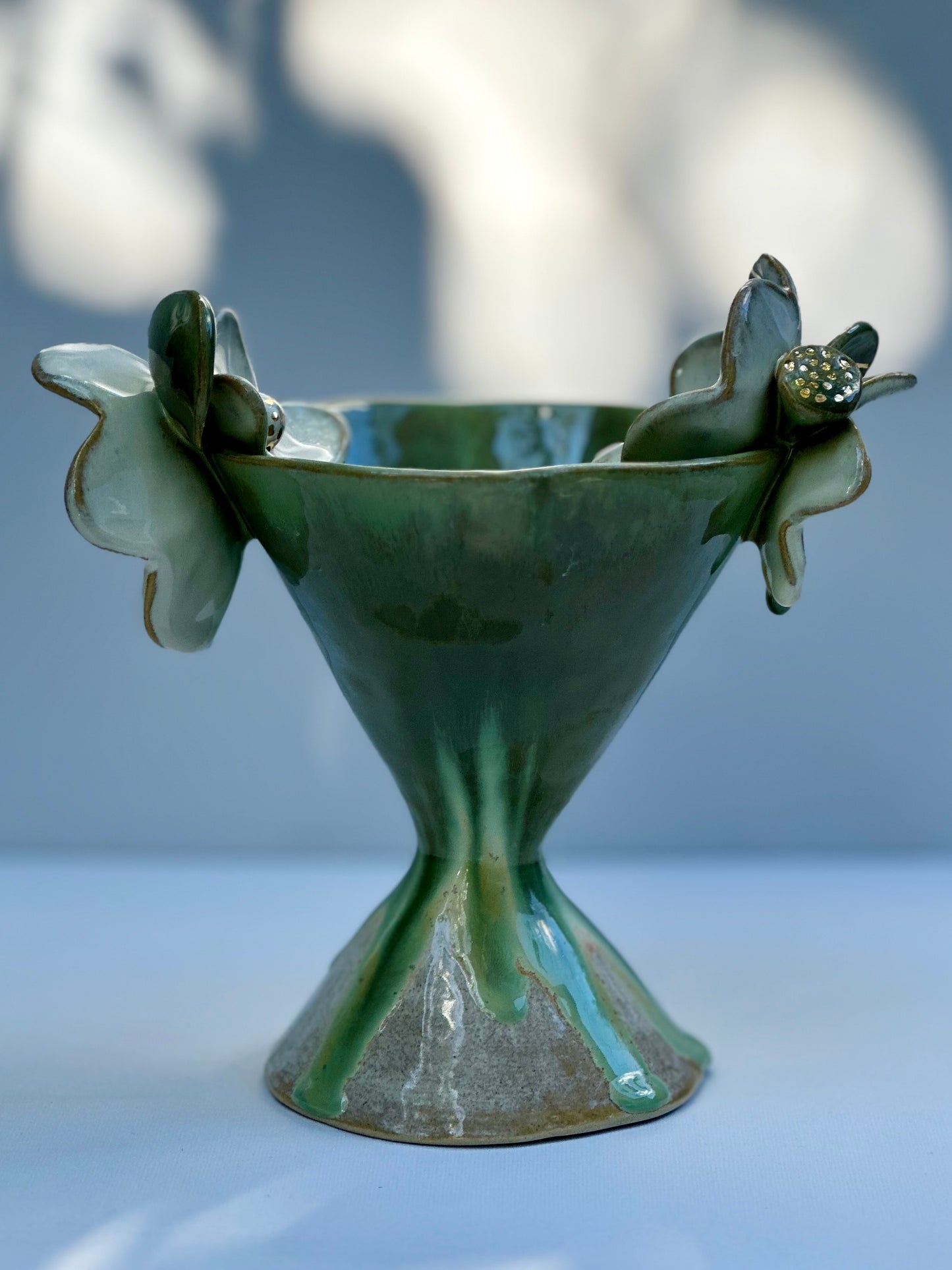 Gemma, Falling Green Trophy with White Blooms