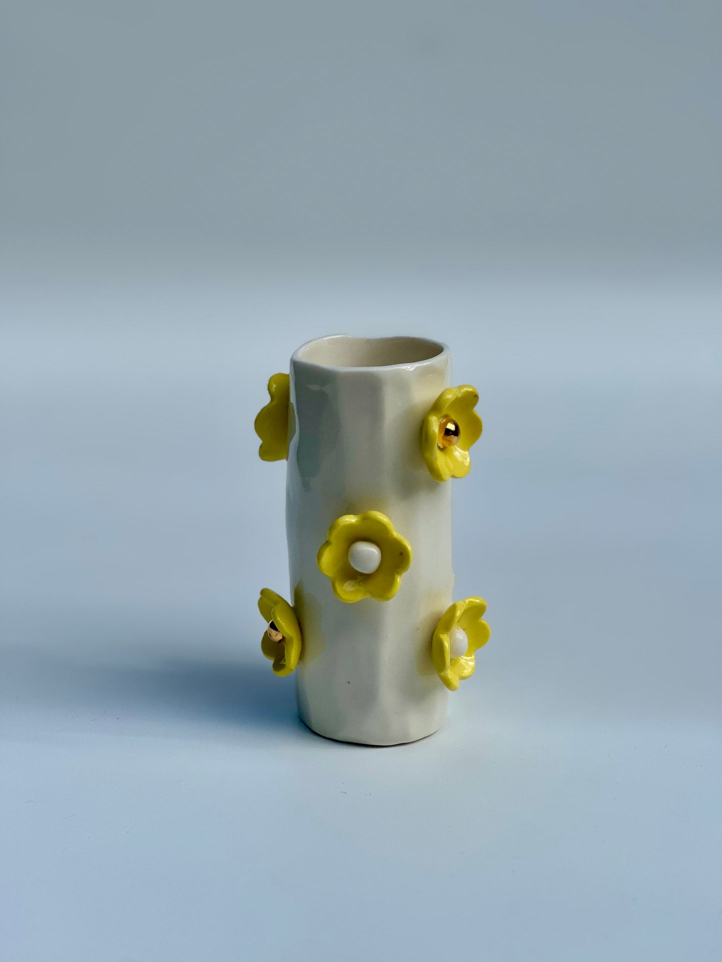 White Porcelain Vase with Daisy Yellow Flowers
