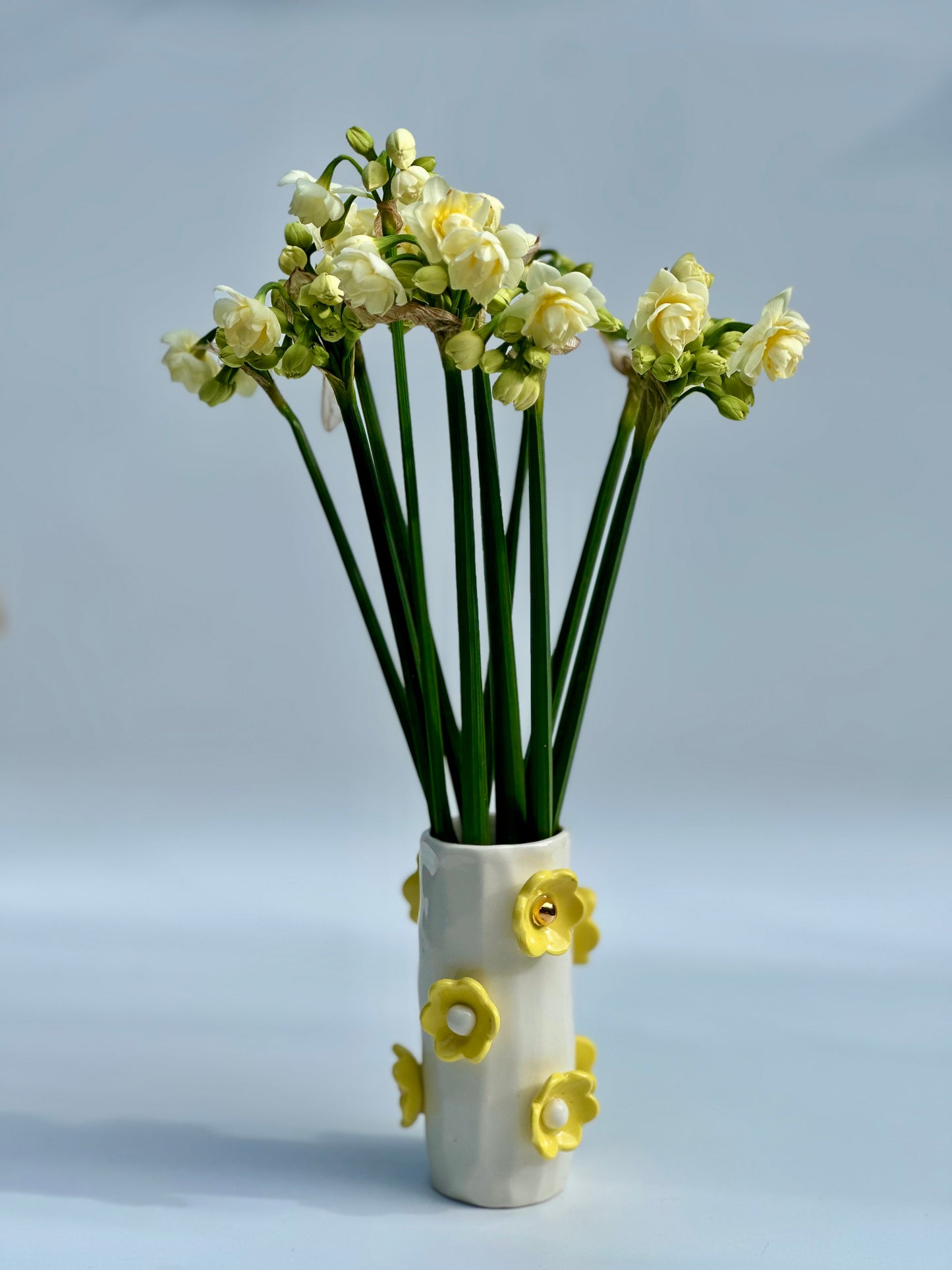 White Porcelain Vase with Daisy Yellow Flowers