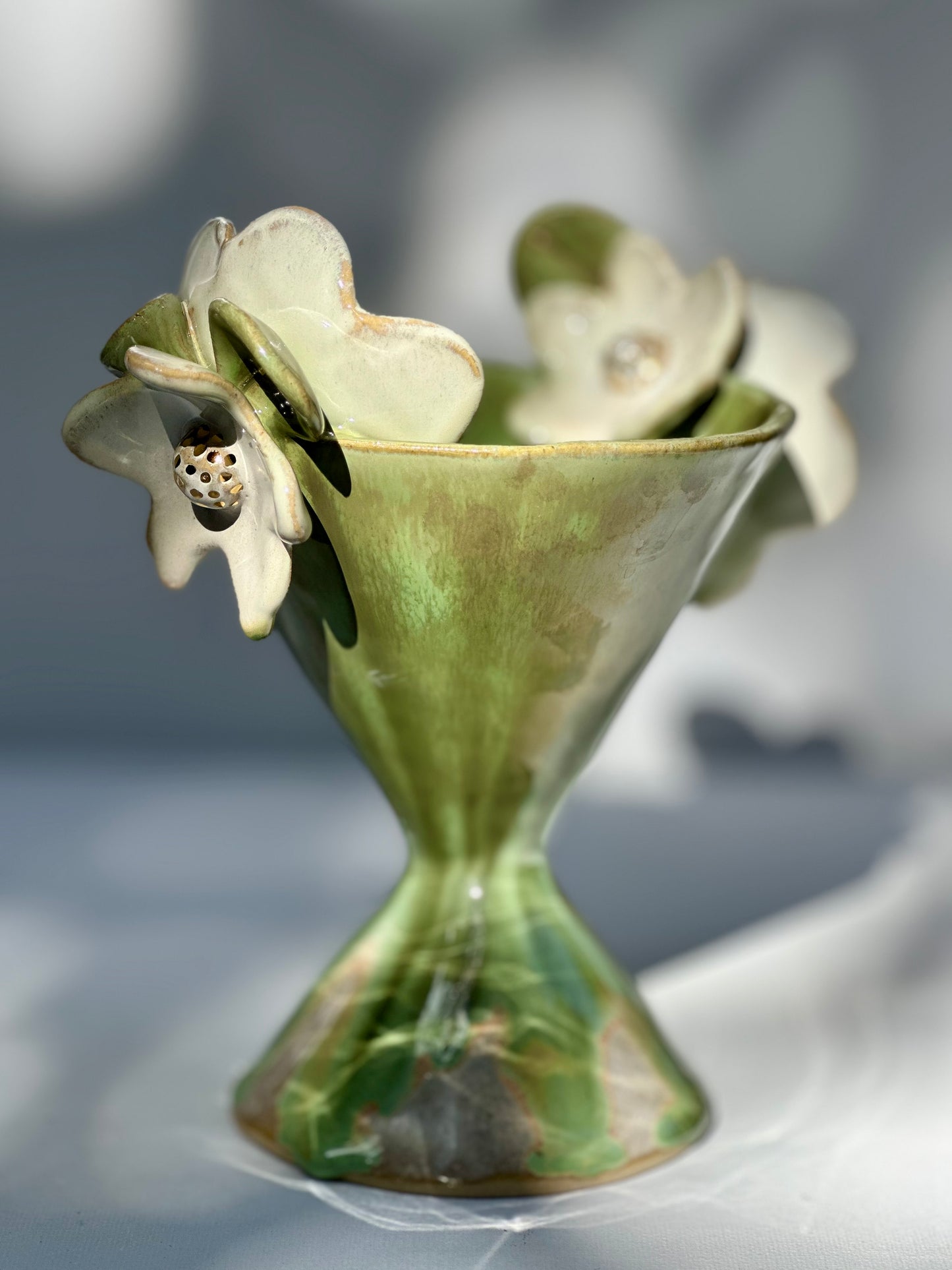 Gemma, Falling Green Trophy with White Blooms