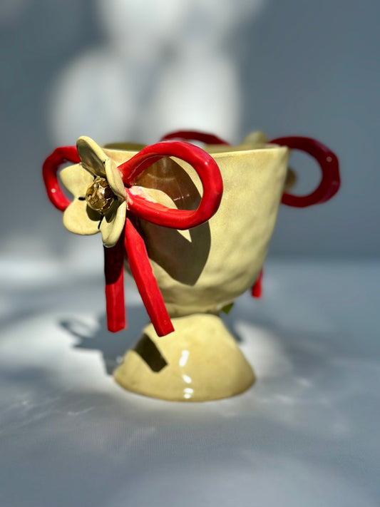 Daisy, Yellow Trophy with Red Bows
